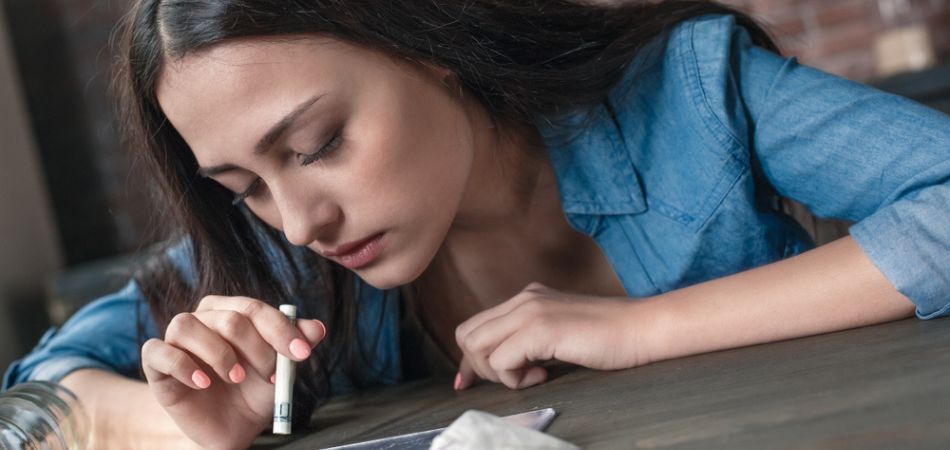 young woman Snorting Cocaine