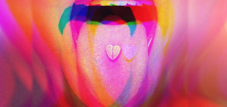 MDMA pill on mouth