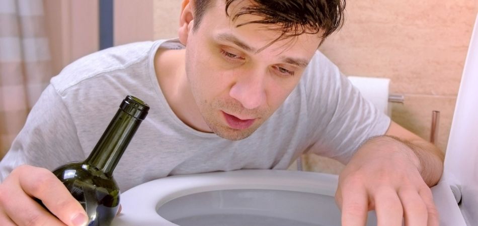 alcoholic man vomiting