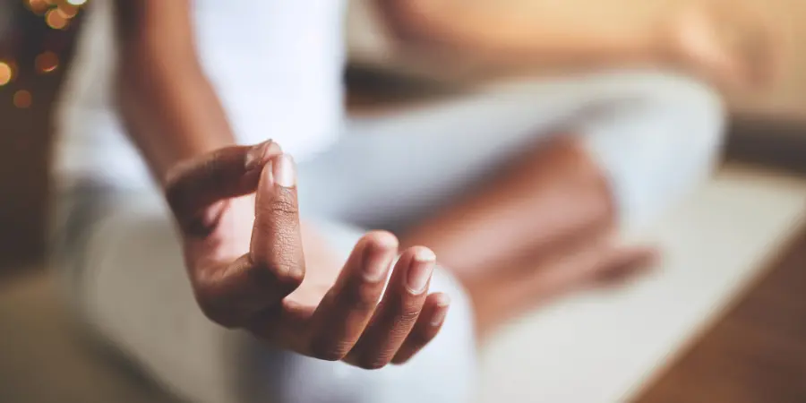 A person meditating to treat schizophrenia