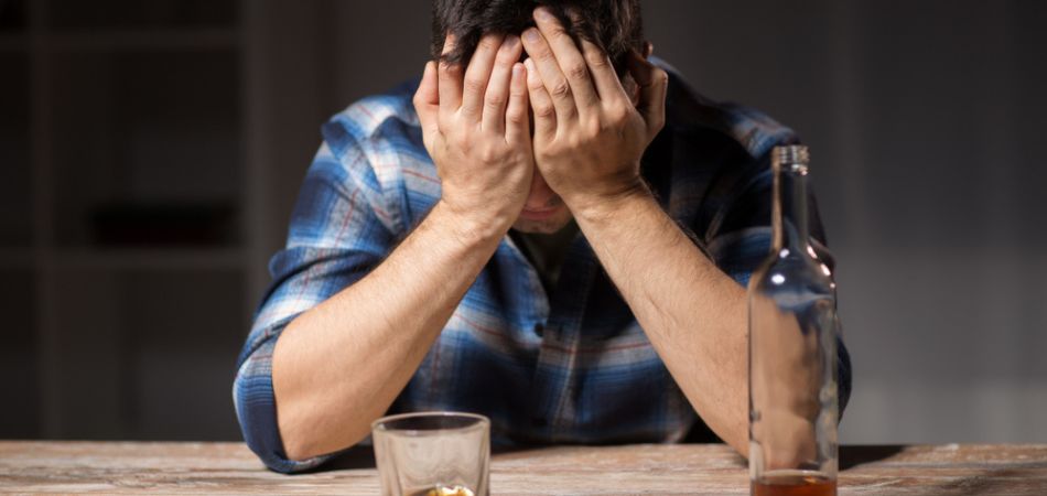 Alcohol addict suffering from a hangover