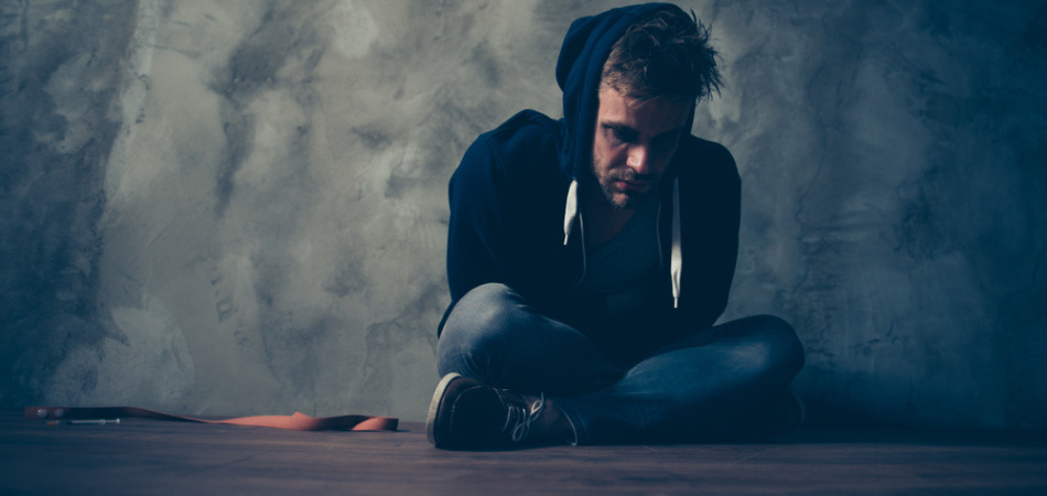 Man sitting on dark in depression