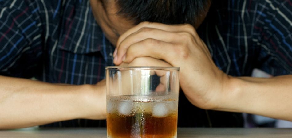 stressfull-man-with-glass-of-alcohol
