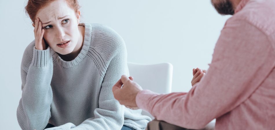 Therapist cheering up addicted woman