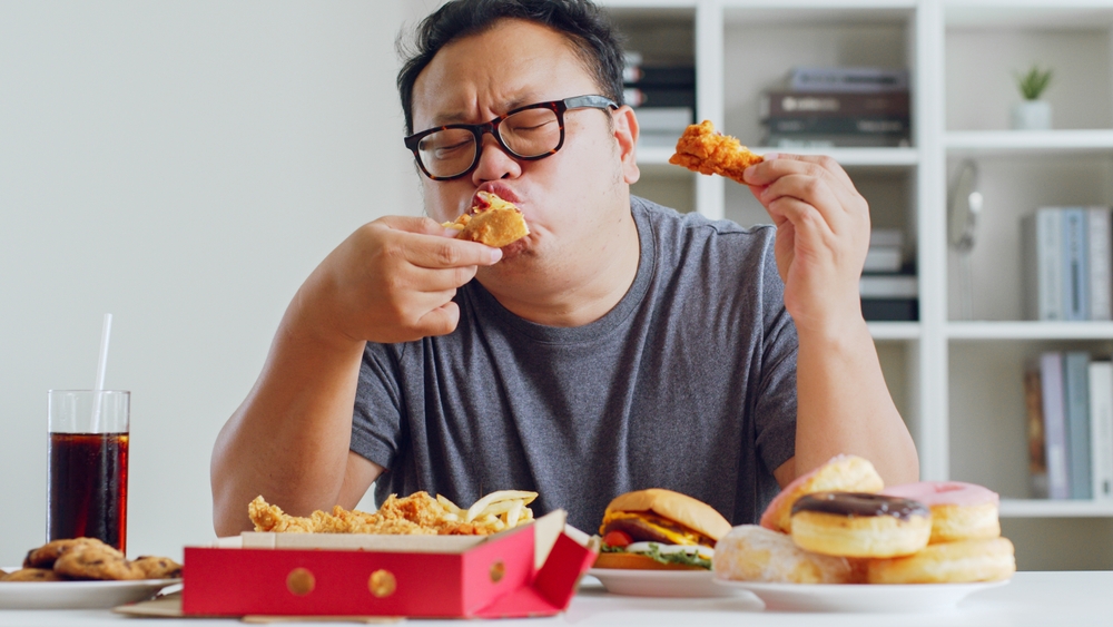 fat man over eating