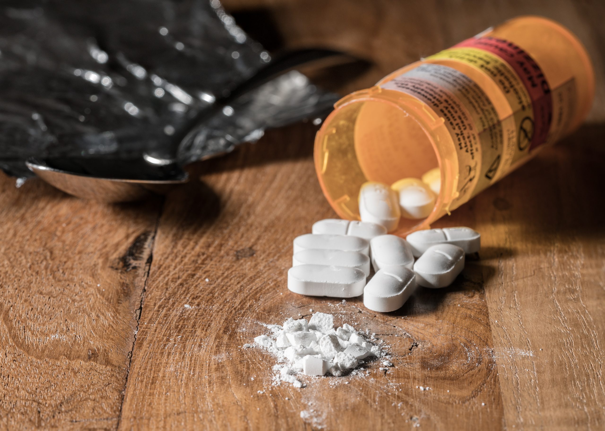 Opioid pills scattered across a table