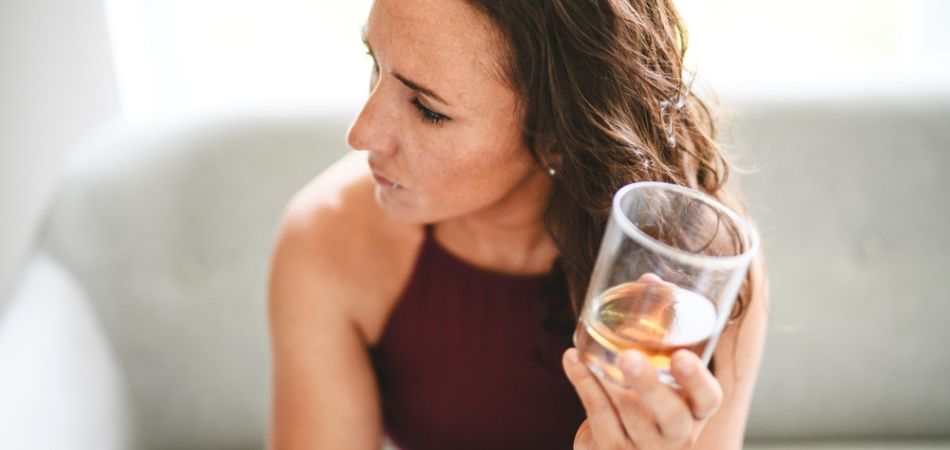 Woman with glass of alcohol