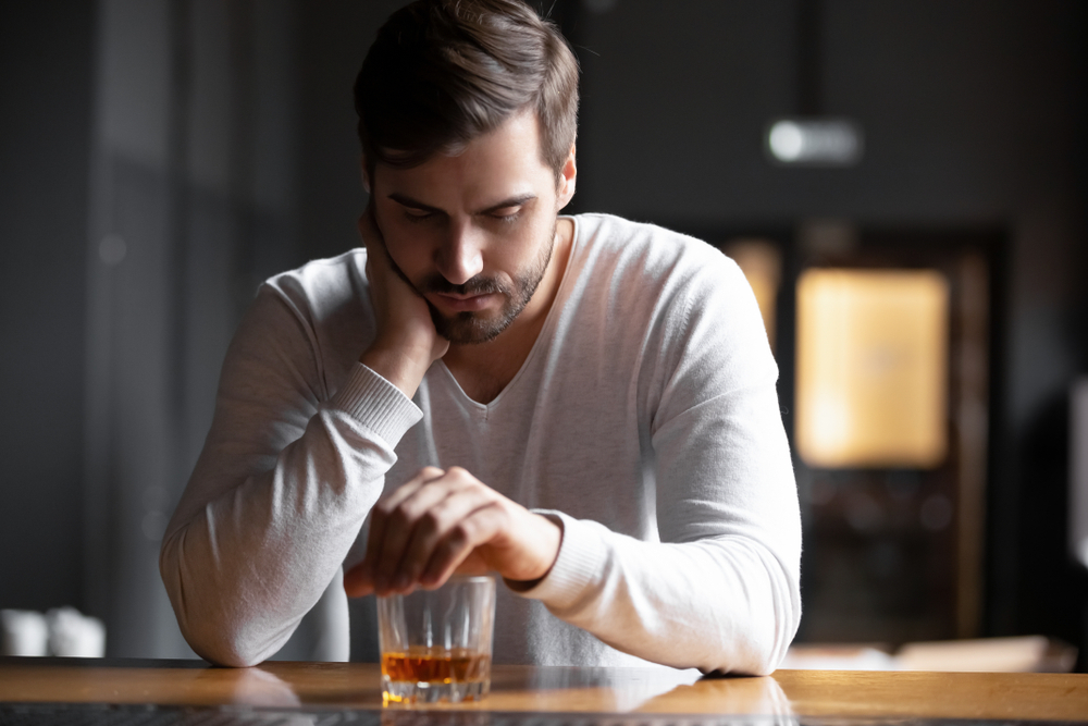 man drinking wine