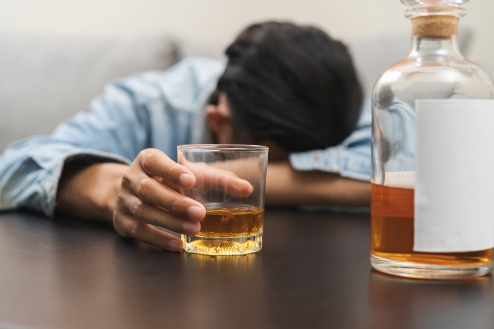 man in stress and drinking alcohol