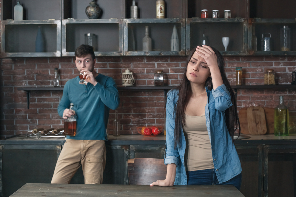 Man driking alcohol in house