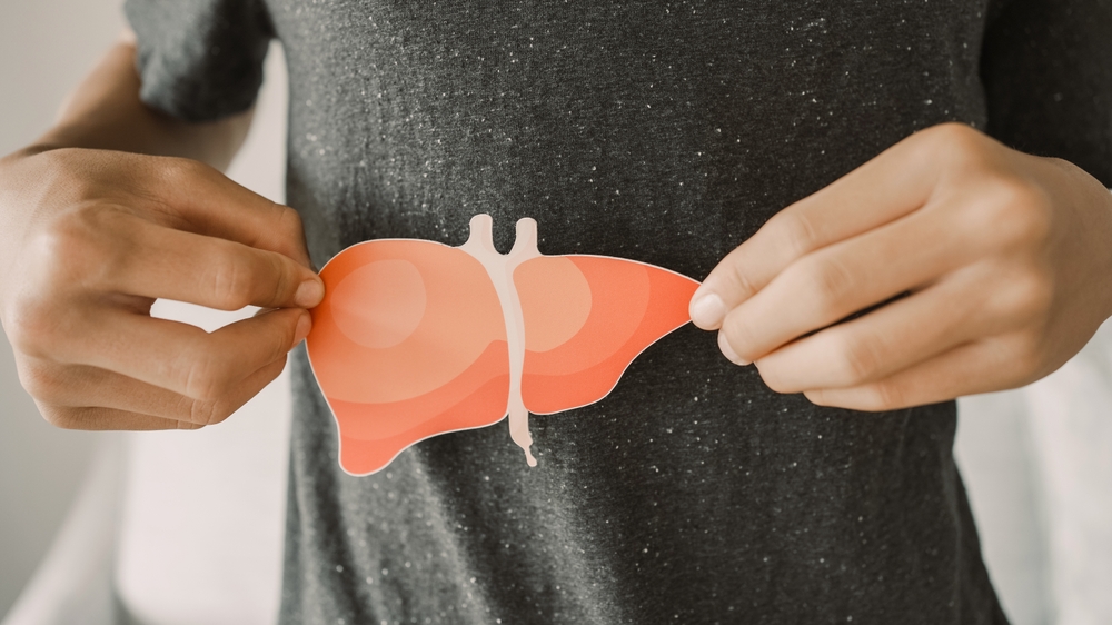 Man holding liver image