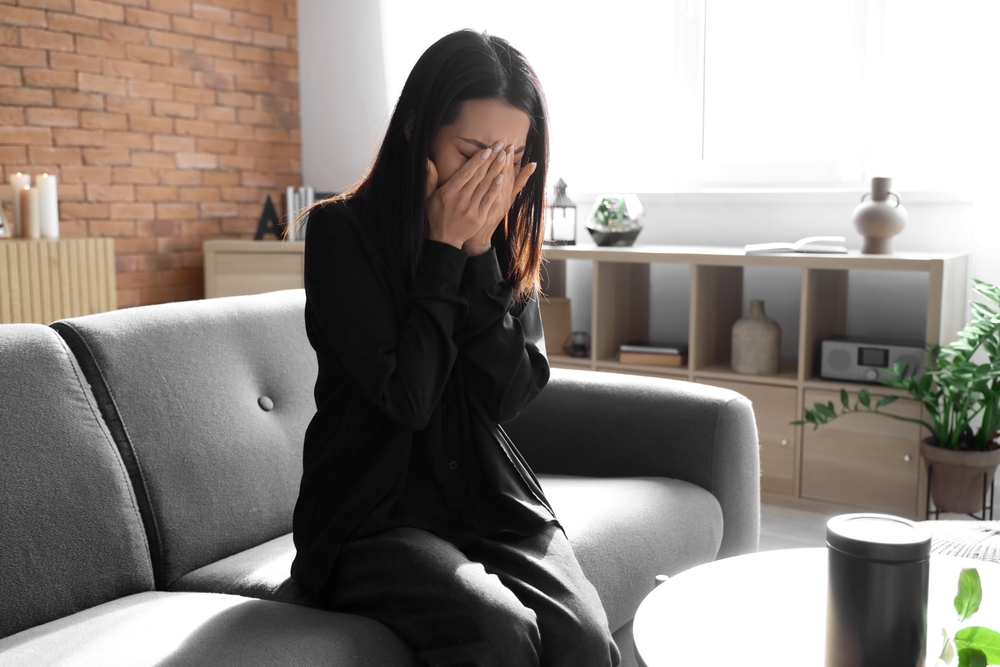 woman-crying-on-sofa