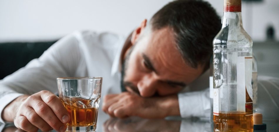 man-with-glass-of-alcohol