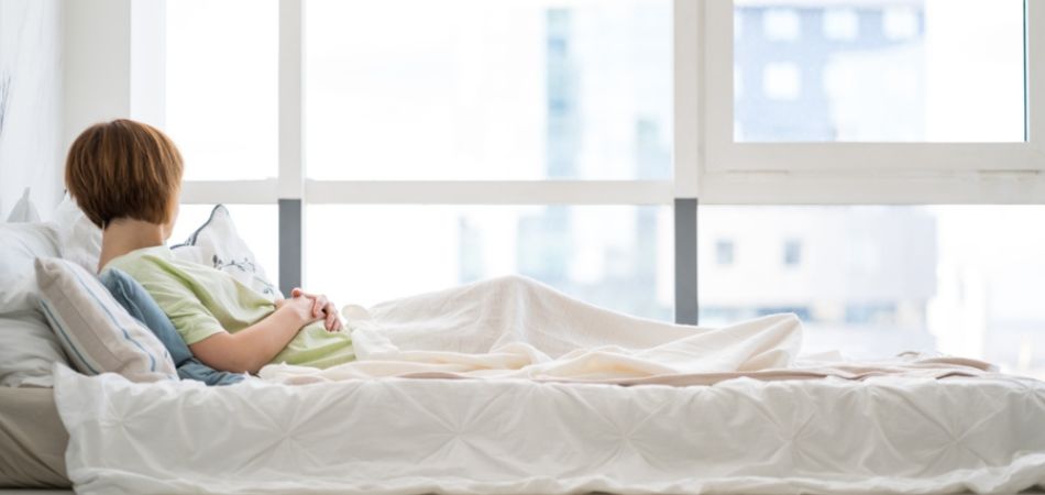 Addictited girl lying on bed